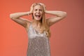 Upset distressed pressured fed up panicking young blond woman in dress scream cry heart out being heartbroken close eyes Royalty Free Stock Photo
