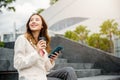 Lifestyle woman business people smiling using mobile smart phones in city office building Royalty Free Stock Photo