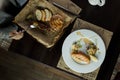 Lifestyle woman eats fish tartare. Healthy and tasty food from raw meat. Close-up of female hands. Great serve. Top view Royalty Free Stock Photo