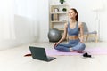 lifestyle woman lotus health video mat home laptop care training yoga