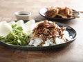 Lifestyle Yakitori Duck with rice, cumin, and sauce on black platter Royalty Free Stock Photo