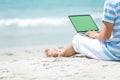 Lifestyle young asian man working on laptop while sitting chill on the beautiful outdoor beach, freelance working social on holida Royalty Free Stock Photo