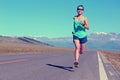 lifestyle young fitness woman runner running on road