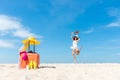 Lifestyle young woman relax on the summer beach.  Asia tourism people jumping and chill in holiday Royalty Free Stock Photo