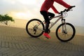 Lifestyle young woman riding bike on seaside Royalty Free Stock Photo