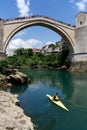 Lifiguard on the boat and jumpers on the Old Bridge in Mostar