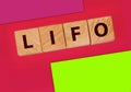 LIFO Last in, first out word on wooden cubes. Accounting, Business Concept Royalty Free Stock Photo