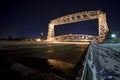 Lift bridge in Duluth Minnesota at night. Ice on the water, wintertime Royalty Free Stock Photo