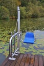 A lift chair as device for handicapped persons on the Ibm lake, in Upper Austri Royalty Free Stock Photo