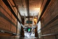 Lift machinist repairing elevator in lift shaft Royalty Free Stock Photo