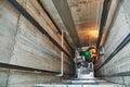 Lift machinist repairing elevator in lift shaft Royalty Free Stock Photo