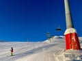Lift support and skiing slope in the Austrian Alps on a sunny day. Golm, Austria.