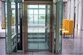 Lift with transparent glass doors in modern building Royalty Free Stock Photo