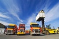 Lift truck loading shipping containers onto trucks