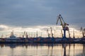 Lifting cranes and containers in the cargo port Royalty Free Stock Photo