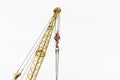 Lifting mechanism of the machine bridge crane with steel cable and hook on a white background Royalty Free Stock Photo