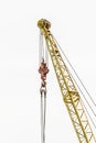 Lifting mechanism of the machine bridge crane with steel cable and hook on a white background Royalty Free Stock Photo