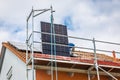Lifting solar panels using pulley. Installing solar panels on a roof. Solar panels on roof
