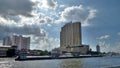 Light from above through white cloud on the building and river Royalty Free Stock Photo