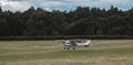 Light aircraft preparing for flight from a field