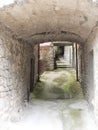 Light and airy alleyway, narrow street, in ancient village, Italy.. Royalty Free Stock Photo