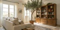 Interior of light living room with sofa, olive tree and shelf units Royalty Free Stock Photo