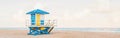 Light airy tropical Florida landscape with blue yellow lifeguard house. American Florida nature ocean view with lifeguard tower,