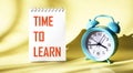 On a light background on a notebook, the text TIME TO LEARN Royalty Free Stock Photo