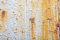 Light background with an old metal surface with streaks of rust and peeling paint. Royalty Free Stock Photo