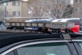 Light bar mounted on the roof of a black police car with droplets of rain water Royalty Free Stock Photo