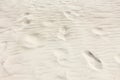 Light beach sand with footprints Royalty Free Stock Photo