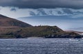 Light beacon on Hornos island under cloudscape, Cape Horn, Chile Royalty Free Stock Photo