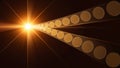 Light beam creating a path of golden circles on a dark background Royalty Free Stock Photo
