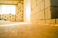 Light beam on an oriented strand board subfloor. The first leveling layer of OSB boards. Renovation process in a newly built