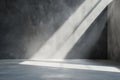 Light beams shine through a space, casting shadows on the gray wall and floor. The simple design suggests a moment of quiet Royalty Free Stock Photo