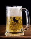 Light Beer in a glass pint mug served on a wooden Royalty Free Stock Photo