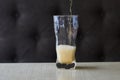 Light beer pouring in glass Royalty Free Stock Photo