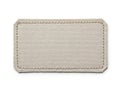 Light beige canvas fabric patch with double-stitching edge detailing for crafting and textile projects Royalty Free Stock Photo