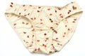 A light beige colored woman panties with small orange and brown heart printings Royalty Free Stock Photo