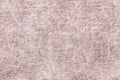 Light beige fluffy background of soft, fleecy cloth. Texture of brown textile backdrop with shiny pattern Royalty Free Stock Photo