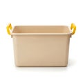Light beige plastic storage bin with yellow handles for household organization Royalty Free Stock Photo