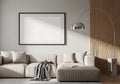 Beige sectional sofa with grey throw and blank picture frame couch cream Royalty Free Stock Photo