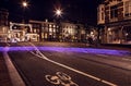 Light from bicycle wheel on street in night Amsterdam.