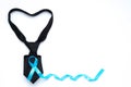 Light blue awareness ribbon and black necktie heart shape for pr