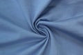 Light blue background of fabric from a piece of crumpled clothes. Top view. crumpled polyester