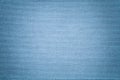 Light blue background from a textile material. Fabric with natural texture. Backdrop