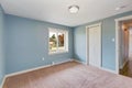 Light blue bedroom with closets