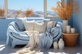 Light blue and beige sofa, blanket and pillow, vases by window and desert view in background Royalty Free Stock Photo