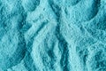 Light blue bentonite clay powder alginate, facial mask, eye shadow, body wrap texture close up, selective focus. Abstract