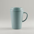 A light blue ceramic mug featuring a sleek, modern design with a smooth texture. The Royalty Free Stock Photo